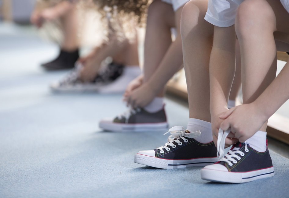 Kids tying shoelaces